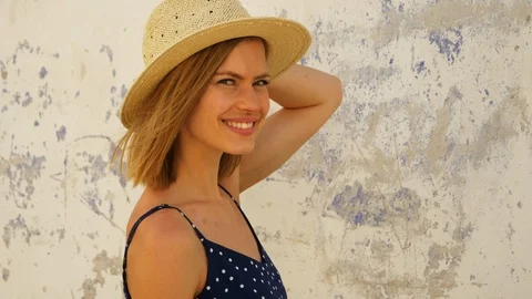 Model holding hat looking sideways Stock Footage 107011629