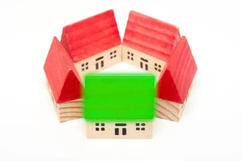 Model homes arranged on isolated white background for construction industry Stock Photos