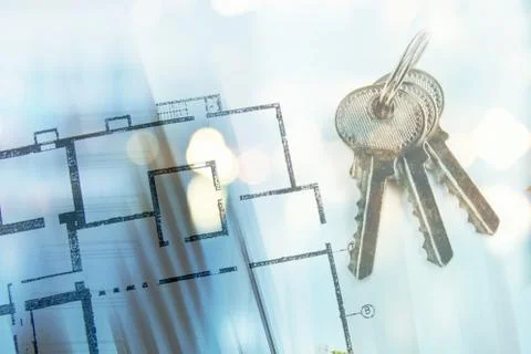 Model of a house and key ring on a blueprint Stock Photos