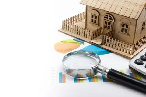 Model house, construction plan for house building, magnifying glass compass Stock Photos