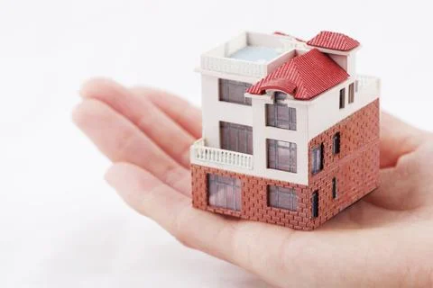 With the model house Stock Photos