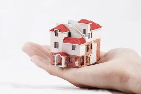 With the model house Stock Photos