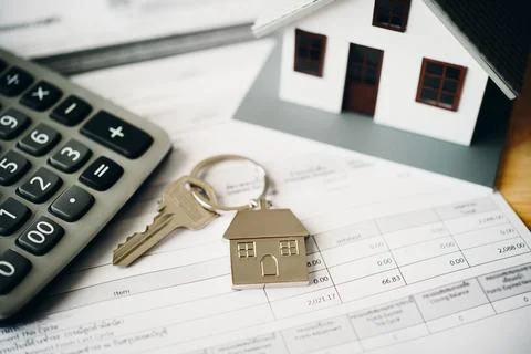 Model of house placed on contract Placed on a wooden table, mortgage and re.. Stock Photos