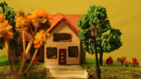 Model house in a tree-lined garden Stock Footage 220870217