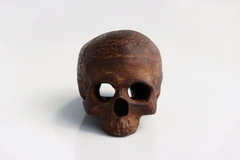 A model of a human skull in the form of a candlestick on a white background. Stock Photos