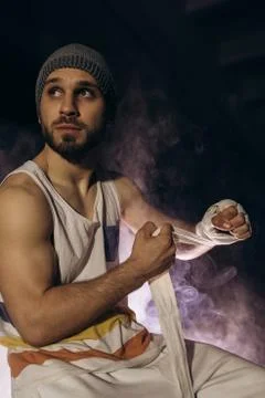 Model isolated on dark background in smoke. Stock Photos