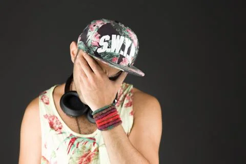 Model isolated on plain background ashamed hiding face in hand Stock Photos