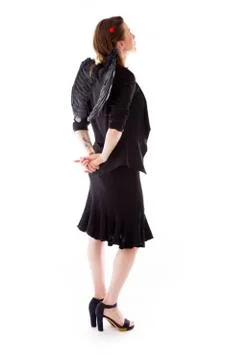Model isolated on plain background back looking behind Foto stock