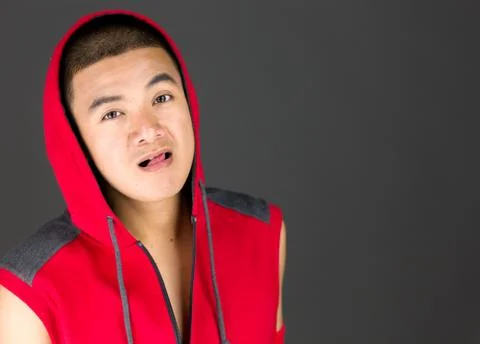 Model isolated on plain background face sticking tongue out Stock Photos