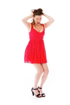 Model isolated on plain background stressed upset pulling hairs Stock Photos