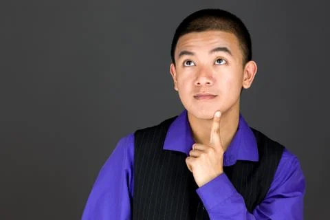 Model isolated on plain background thinking Stock Photos