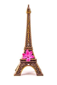 Model of little Eiffel Tower with a pink flower Stock Photos