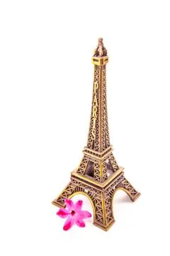 Model of little Eiffel Tower with a pink flower Stock Photos
