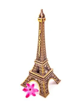 Model of little Eiffel Tower with a pink flower Stock Photos