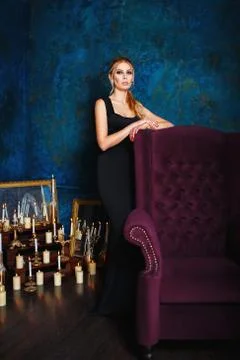 Model in long black gown in studio Stock Photos