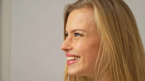Model looking to distant then smiles on cmaera Stock Footage 103628839