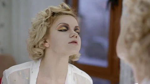 Model looking to the mirror Stock Footage 91092876