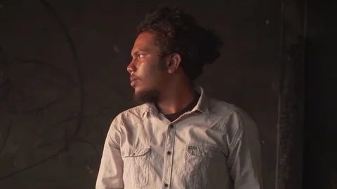 Model looking out during portrait sunset tight headshot stylish young youth man Video stock 107879313