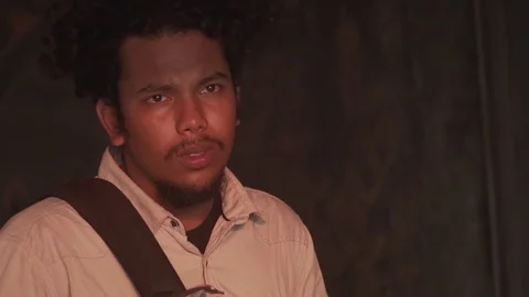 Model looking out during portrait sunset tight headshot stylish young youth man Video stock 108330186