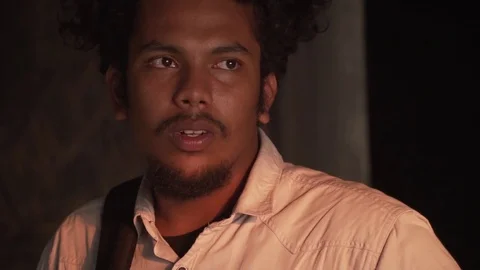 Model looking out during portrait sunset tight headshot stylish young youth man Stock Footage 108330896