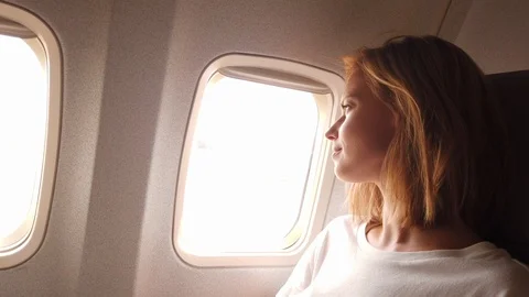 Model looking outside the window Video stock 107934246