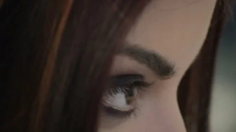 Model looks in mirror then makeup artist finishes work Video stock 43978195