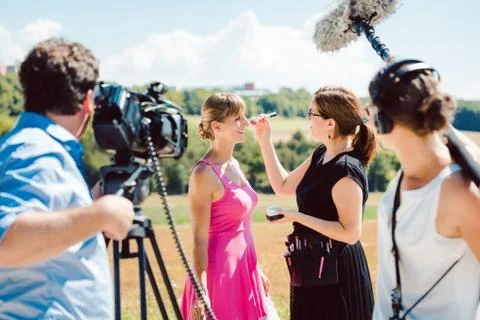 Model in the make-up during video shoot on production set Stock Photos