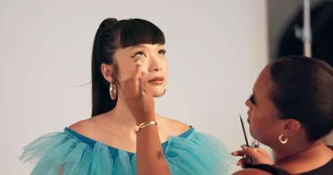 Model, makeover and women with makeup, backstage and photoshoot preparation, Stock Footage 329380649