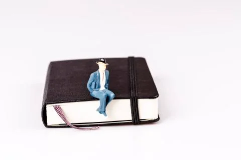 Model of man sitting on organizer Stock Photos