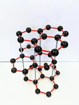 A model of a molecule is arranged on a table for presentation Stock Photos