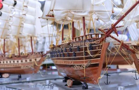 Model of an old sailing ship in a showcase of a gift shop. Stock Photos