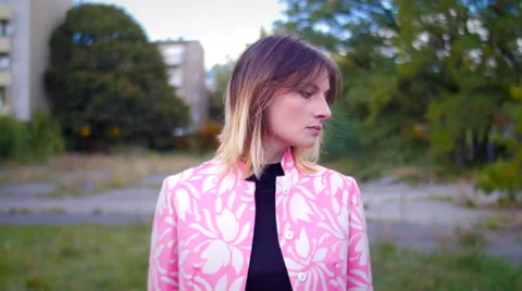 Model with pink dress posing and looking in camera Stock Footage 59736587