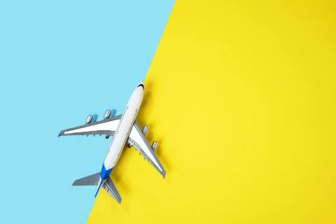 Model plane airplane or plane on yellow and blue background. Stock Photos
