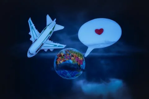 Model plane circling globe. Black background. Stock Photos