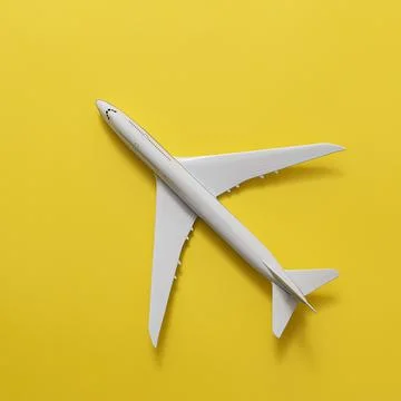 Model plane on yellow background Stock Photos