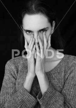 Model portrait test with young beautiful fashion model wearing grey jumper Stock Photos