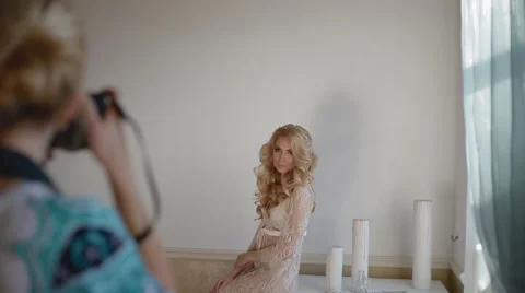 Model pose to photographer in studio Stock Footage 64205109