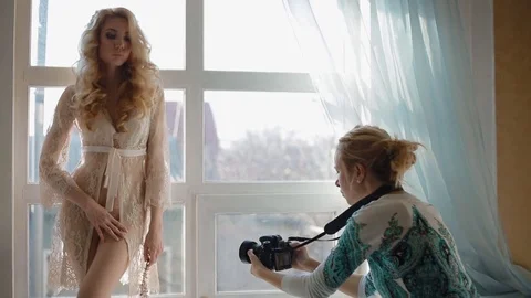 Model pose to photographer in studio Stock Footage 70461172