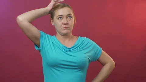 Model poses for camera performing thoughtful lady Stock Footage 129946295