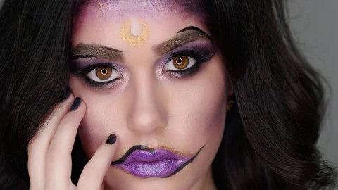 Model poses for the camera in the studio in her makeup for Halloween Stock-Footage 97456168