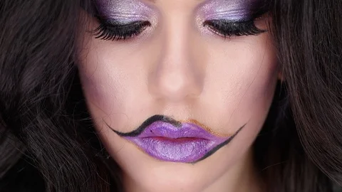 Model poses for the camera in the studio in her makeup for Halloween 스톡 동영상 97456710