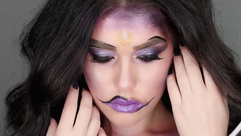 Model poses for the camera in the studio in her makeup for Halloween Stock-Footage 97457181