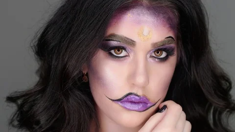 Model poses for the camera in the studio in her makeup for Halloween Stock-Footage 97457332