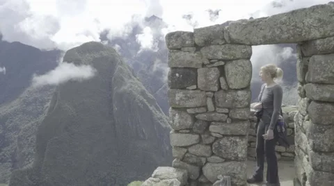 Model Poses in Stone Castle in the Mountains of Machu Picchu Peru Stock-Footage 56451786