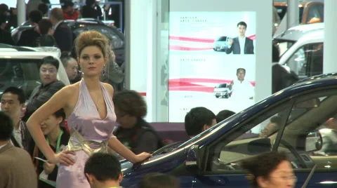 Model posing at Beijing Auto Show, China Stock Footage 56585998