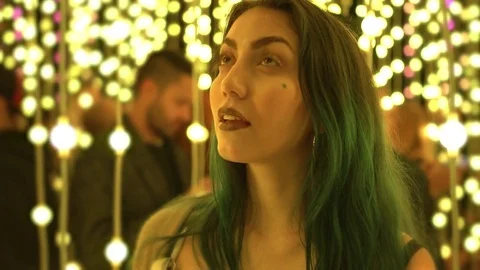 Model Posing Between Multicolored Lights Stock Footage 81500623