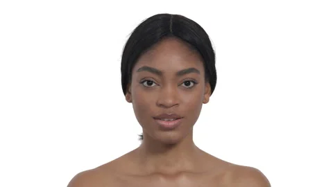 Model posing to camera. African woman closing her face with palms and opening Stock Footage 131422988