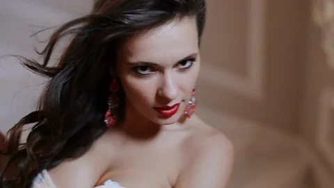 Model Posing For The Camera On A White Background, Portrait Fashion And Beauty Video stock 108200336