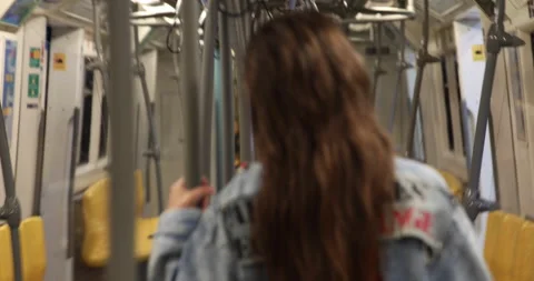 Model is posing in carriage of metro train Stock Footage 233639270