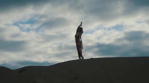 Model posing on a hill on a cloudy day Video stock 85741869